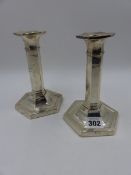 A PAIR OF SILVER HALLMARKED TALL CANDLESTICKS. B'HAM 1915. H.16.5cms.