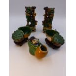 A PAIR OF CHINESE SANCAI POTTERY JOSS STICK HOLDERS IN THE FORM OF FOO DOGS (H.15cms.), A PAIR OF