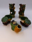 A PAIR OF CHINESE SANCAI POTTERY JOSS STICK HOLDERS IN THE FORM OF FOO DOGS (H.15cms.), A PAIR OF