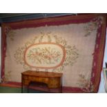 A LARGE NEEDLEPOINT CARPET OF FRENCH AUBUSSON DESIGN.