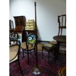 AN ART DECO INLAID MAHOGANY TAPERED FORM FLOOR LAMP ON OCTAGONAL BASE WITH CARVED ACORN MARK. H.