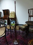 AN ART DECO INLAID MAHOGANY TAPERED FORM FLOOR LAMP ON OCTAGONAL BASE WITH CARVED ACORN MARK. H.