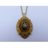 AN EARLY VICTORIAN GARNET AND PEARL SCALLOPED EDGE ETRUSCAN STYLE PENDANT. THE CENTRE CABOCHON
