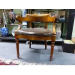 AN ANTIQUE FRENCH WALNUT 19th.C.TUB FORM ARMCHAIR WITH RING TURNED TAPERED FRONT LEGS.