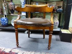 AN ANTIQUE FRENCH WALNUT 19th.C.TUB FORM ARMCHAIR WITH RING TURNED TAPERED FRONT LEGS.