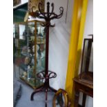 A VINTAGE THONET BENTWOOD HAT AND COAT STAND WITH REVOLVING TOP SECTION, THE BASE STAMPED THONET,