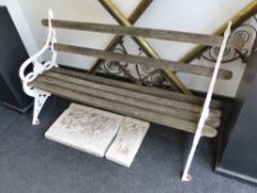 A GARDEN BENCH OF VICTORIAN DESIGN WITH WOOD SLAT BACK AND SEAT. W.165cms.