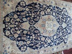 A PERSIAN SAROUK RUG. 220 x 138cms.