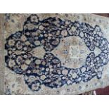 A PERSIAN SAROUK RUG. 220 x 138cms.