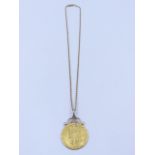 A SPADE GUINEA COIN MOUNTED AS A PENDANT WITH A SCROLL TOP SUSPENDED ON A 9ct GOLD BELCHER CHAIN (