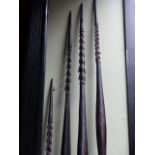 A GROUP OF FIVE ANTIQUE TRIBAL FISHING SPEARS WITH CARVED DECORATION, PROBABLY OCIANIC TOGETHER WITH
