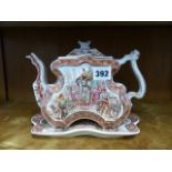 A BURGESS & LEIGH WARE TEAPOT AND STAND DECORATED WITH AN INDIAN PATTERN. (2)