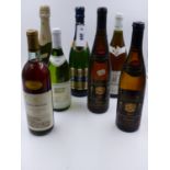 A MIXED LOT OF SEVEN BOTTLES TO INCLUDE SPARKLING AND GERMAN WINE.