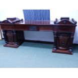 AN IMPRESSIVE CARVED AND INLAID 19th C. MAHOGANY TWIN PEDESTAL SIDEBOARD IN THE MANNER OF GEORGE