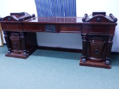 AN IMPRESSIVE CARVED AND INLAID 19th C. MAHOGANY TWIN PEDESTAL SIDEBOARD IN THE MANNER OF GEORGE