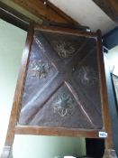 TWO OAK FRAMED ARTS AND CRAFTS FIRE SCREEN, ONE WITH FLORAL CREWEL WORK INSET THE OTHER REPOUSSE