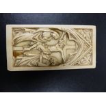 AN EARLY CARVED IVORY PLAQUE OF THE CRUCIFICTION IN THE GOTHIC TASTE. 9.5 x 4.5cms.
