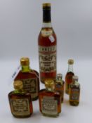 A BOTTLE OF HENNESSY COGNAC AND VARIOUS MINIATURES.
