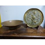A 20th.C.COPPER OVAL FOOTED SHALLOW BOWL STAMPED WITH SEA HORSE RID AND A HEAVY PIERCED BRASS
