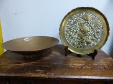 A 20th.C.COPPER OVAL FOOTED SHALLOW BOWL STAMPED WITH SEA HORSE RID AND A HEAVY PIERCED BRASS