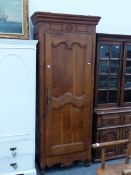 A 19th.C.FRENCH WALNUT SINGLE DOOR ARMOIRE WITH FITTED SHELVES.