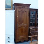 A 19th.C.FRENCH WALNUT SINGLE DOOR ARMOIRE WITH FITTED SHELVES.