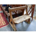 AN ANTIQUE SMALL PINE PEW OF PUGIN DESIGN.