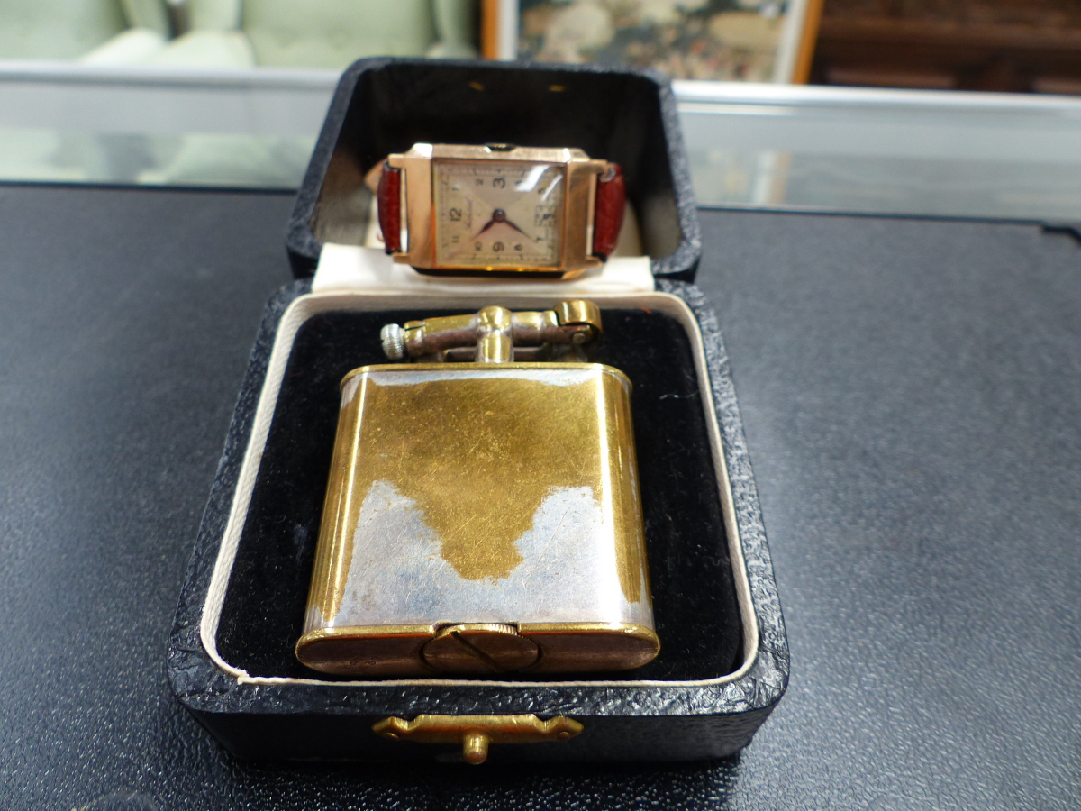 A 9ct GOLD FEDERAL WATCH TOGETHER WITH A DUNHILL LIGHTER.