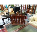 A RETRO ROSEWOOD MAGAZINE STAND AND AN OAK STAND.