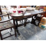 A SMALL OAK REFECTORY STYLE TABLE AND SIX LADDER BACK CHAIRS.