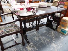 A SMALL OAK REFECTORY STYLE TABLE AND SIX LADDER BACK CHAIRS.