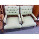 A PAIR OF VICTORIAN BUTTON BACK ARMCHAIRS.