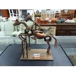 A METAL HORSE AND RIDER DECORATIVE FIGURE.