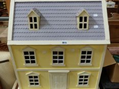 A DOLLS HOUSE WITH FURNISHINGS.