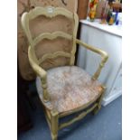 A CONTINENTAL PAINTED LADDER BACK ARMCHAIR.