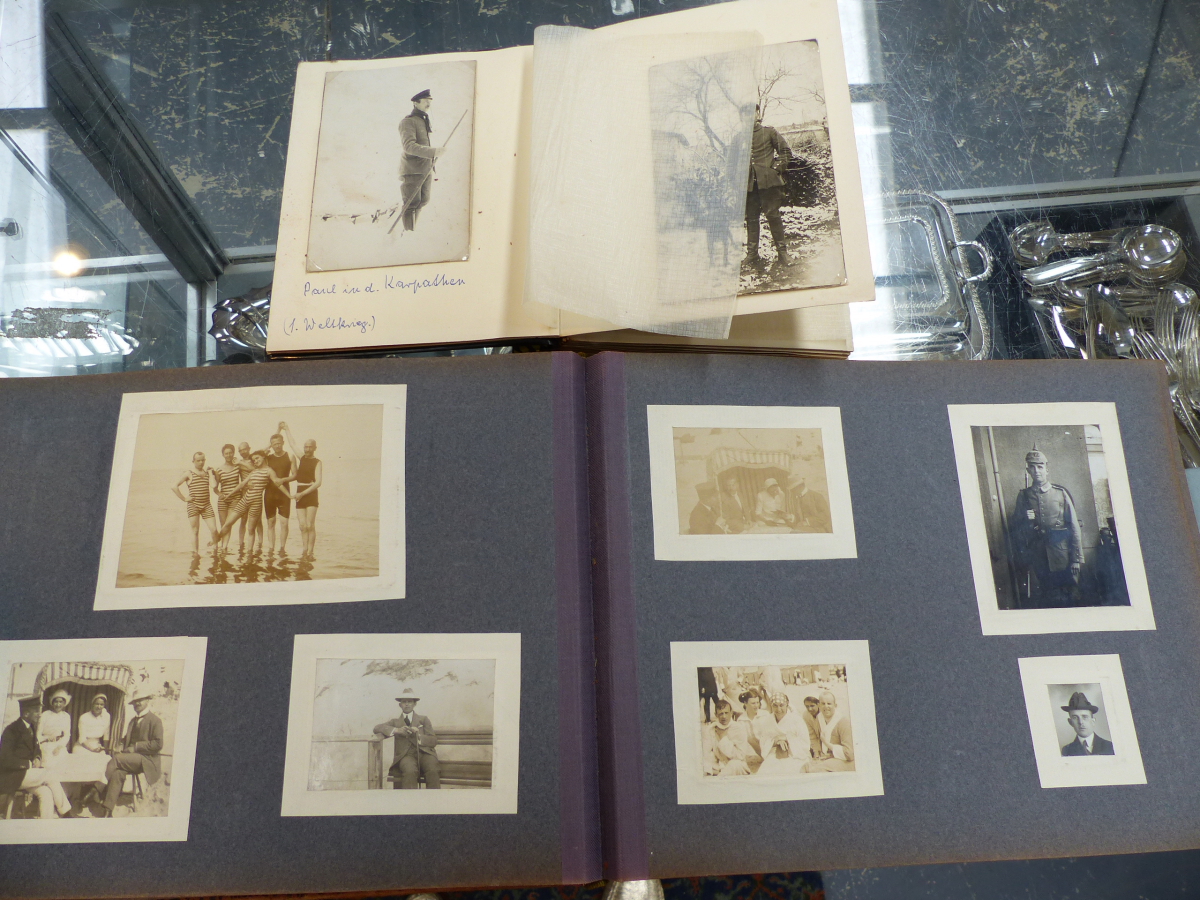 VARIOUS POSTCARDS CONTAINED IN ALBUMS,