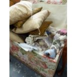 A LARGE VICTORIAN UPHOLSTERED OTTTOMAN TOGETHER WITH A LARGE QTY OF LINENS, TEXTILES,ETC