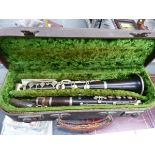 A CASED CLARINET.