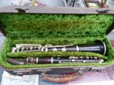 A CASED CLARINET.
