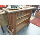 A VINTAGE BAR UNIT WITH FAUX BARK FINISH