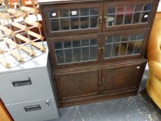 A VINTAGE THREE TIER OAK SECTIONAL BOOKCASE TOGETHER WITH A SMALL METAL FILING CABINET AND A SMALL