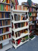 AN ANTIQUE PAINTED WATERFALL BOOKCASE WITH SERPENTINE SUPPORTS AND PIERCED DECORATION.