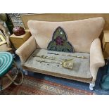 AN EDWARDIAN SMALL SOFA FOR UPHOLSTERY.