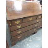 A GOOD QUALITY GEO.III.OAK FALL FRONT BUREAU WITH FITTED INTERIOR OVER THREE SHORT AND THREE LONG