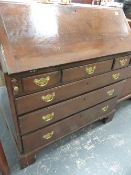 A GOOD QUALITY GEO.III.OAK FALL FRONT BUREAU WITH FITTED INTERIOR OVER THREE SHORT AND THREE LONG