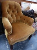 A VICTORIAN BUTTON BACK ARMCHAIR.