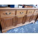 A LARGE VICTORIAN STYLE PINE FOUR DOOR DRESSER BASE.