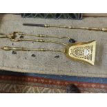A SET OF GOOD VICTORIAN BRASS FIRESIDE TOOLS AND MATCHING DOGS.