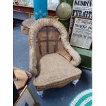 A VICTORIAN ARMCHAIR FOR UPHOLSTERY.
