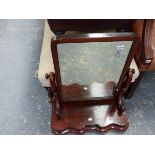 A LARGE VICTORIAN SWING MIRROR